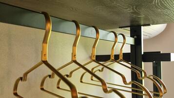 A wall-mounted rack with multiple hooks for hanging items.