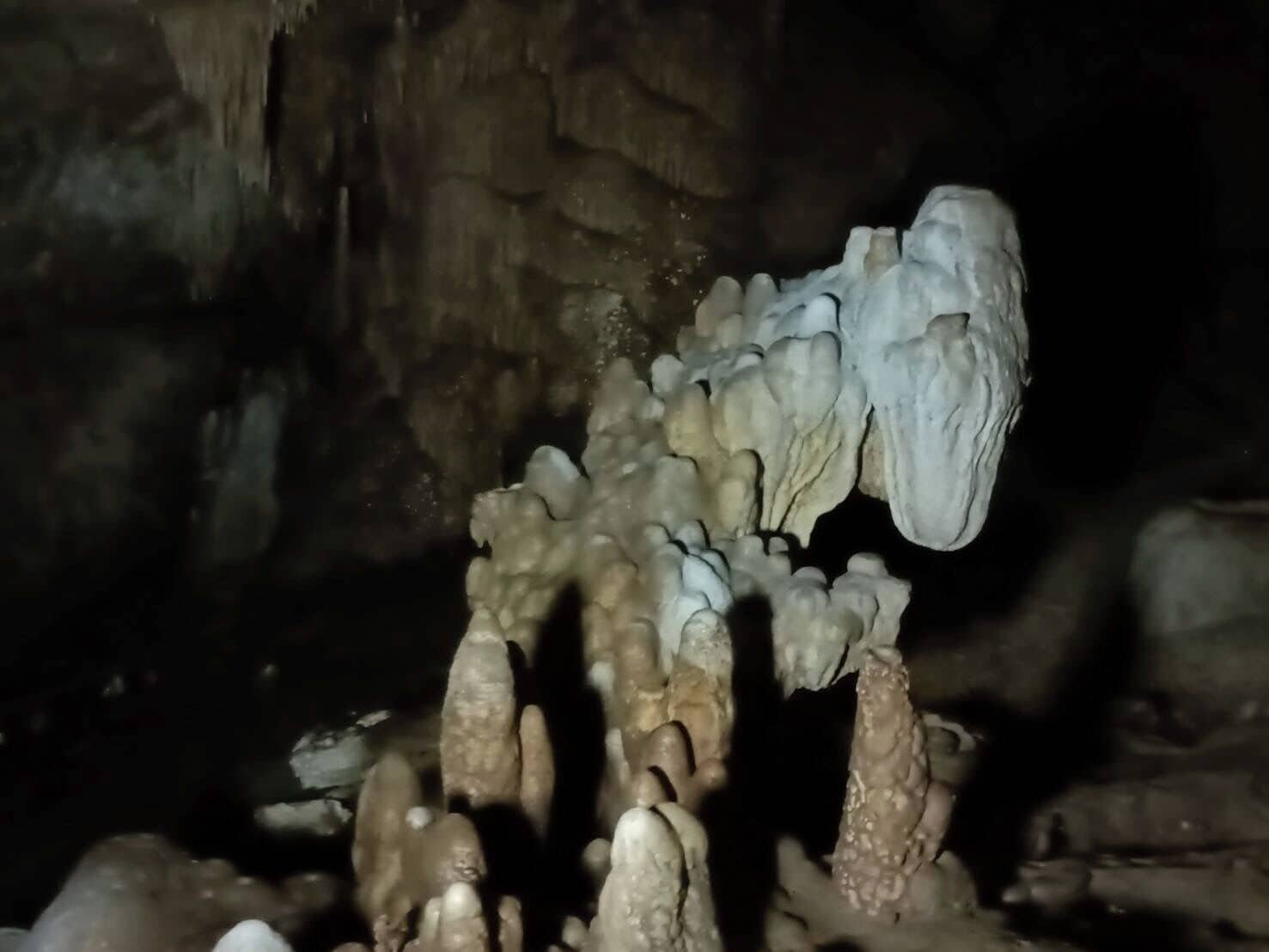 A cave with stalactites and stalagmites.