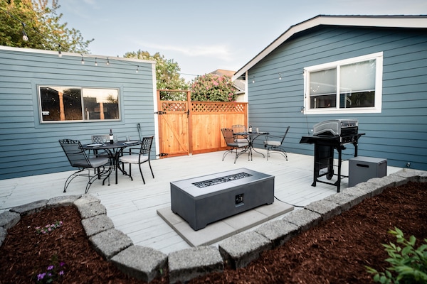 Spacious Backyard with Outdoor Seating, Gas Grill, And Gas Firepit