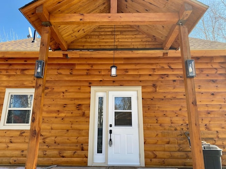 Exterior detail. Log Cabin across from ski Wentworth, with outdoor fire pit and BBQ