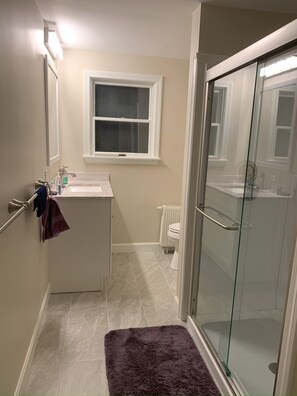 Shower, hair dryer, towels, soap