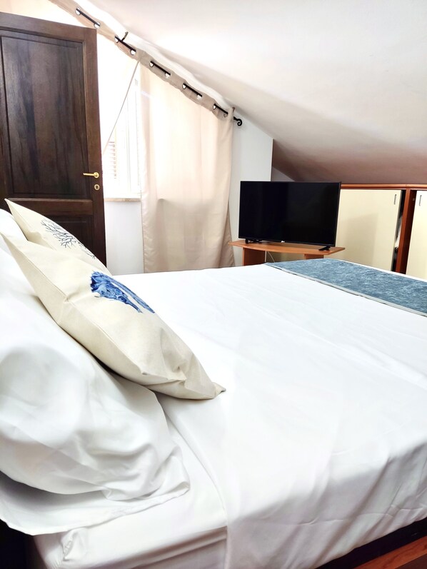 2 dormitorios, tabla de planchar con plancha, wifi y ropa de cama