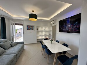 Apartamento conforto | Área de estar | TV de tela plana