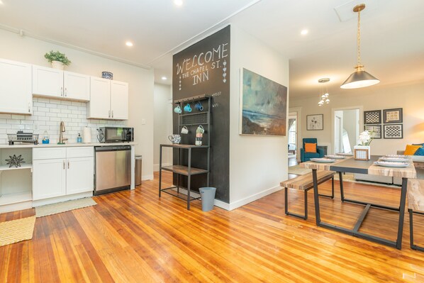 Enjoy meals and social gatherings in this inviting space with a sleek kitchen and open-plan dining area.