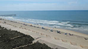 A beach with a pier, sandy beach, and wooden fences. - Cozy, clean 1 bedroom oceanfront condo in Laguna Keyes.  (North Myrtle Beach)