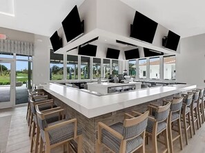 Enjoy cooking and dining in this well-equipped kitchen with a large island and ample counter space.