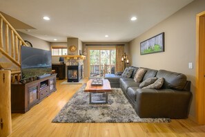 Main floor living area leading to front deck