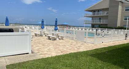 Upscale 1st Floor Beachfront Condo just seconds from the beach and pool