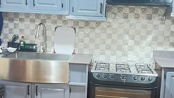 Apartment | Private kitchen | Full-sized fridge, microwave, oven, electric kettle
