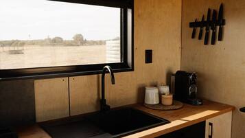 Fridge, stovetop, coffee/tea maker, cookware/dishes/utensils