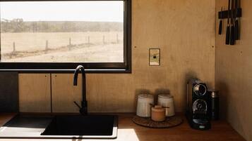 Fridge, stovetop, coffee/tea maker, cookware/dishes/utensils