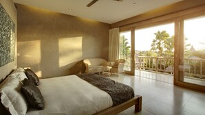 A spacious bedroom with a large bed, a ceiling fan, and a balcony with a view of palm trees. - Villa Seminyak 3 Bedroom (Seminyak)