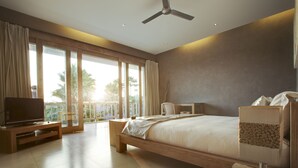 A spacious bedroom with a large bed, a TV, and a balcony with a view of palm trees. - Villa Seminyak 3 Bedroom (Seminyak)