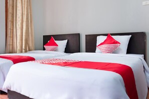 Habitación estándar con 2 camas individuales | Ropa de cama