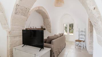 Villa | Living area | 35-inch TV with digital channels