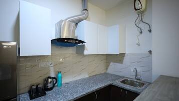 Full-sized fridge, microwave, stovetop, electric kettle