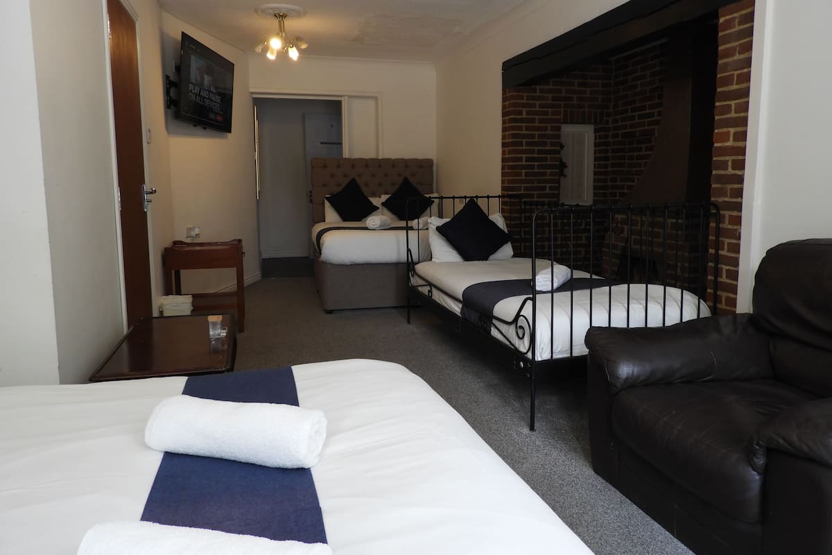 Family Quadruple Room, Multiple Beds, Bathtub, Ground Floor | Iron/ironing board, free WiFi