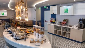 A buffet setup with various food items and a coffee station. - Ibis Styles El Malecon Guayaquil (Guayaquil)