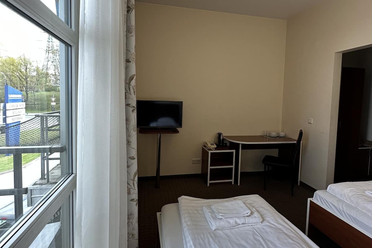 Desk, laptop workspace, free WiFi, bed sheets