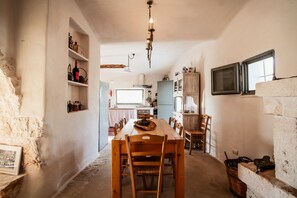 Dining - Old trullo and lamia in one hectar garden pool with view. (Ostuni)