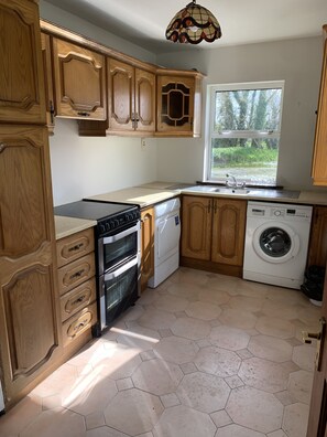 Apartment, Multiple Beds | Private kitchen | Fridge, electric kettle, highchair