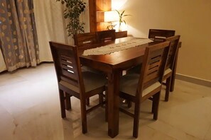 Enjoy meals in this cozy dining area with a wooden table and six comfortable chairs.