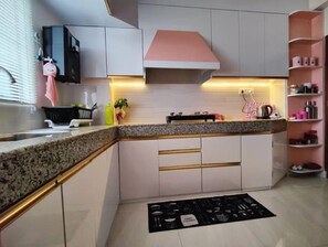 Enjoy cooking in this well-equipped kitchen with an oven and range hood.