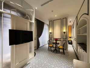 Studio Apartment | Living area | 43-inch Smart TV with cable channels, TV - Le Bonheur Hotel (Phu Quoc)