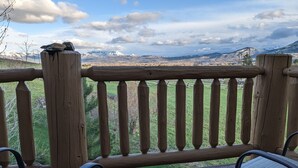 A wooden deck with two chairs and a view of a mountainous landscape. - Eden/Powder Mountain/Snowbasin: mountain getaway, skiing, hiking, biking, golf (Eden)
