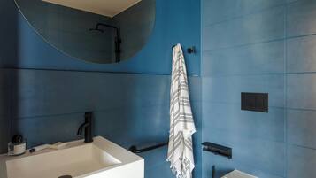 Designer toiletries, hair dryer, towels