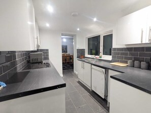 House, Multiple Beds | Private kitchen | Fridge, microwave, oven, stovetop