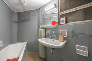 Bathtub, hair dryer, towels, soap