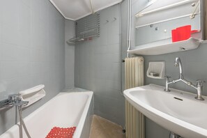 Bathtub, hair dryer, towels, soap