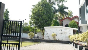 A hotel entrance with a sign reading "CIESTA TREEO Hotels" and a gated driveway. - CIESTA TREEO (Mawal)