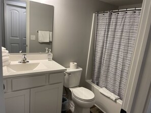 Shower, towels, soap, toilet paper