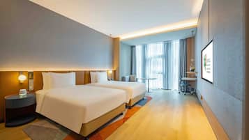 Premium bedding, down comforters, in-room safe, desk