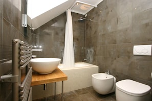 Bathtub, hair dryer, towels