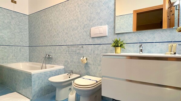Bathtub, hair dryer, towels