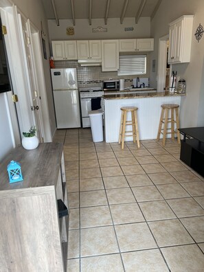 Fridge, microwave, oven, cookware/dishes/utensils