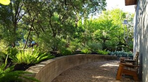 Escape to a serene garden oasis with lush greenery and a tranquil atmosphere.