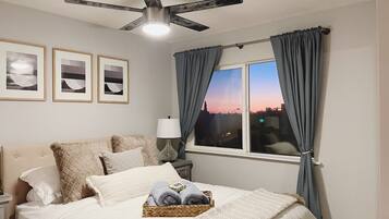 1 bedroom, desk, iron/ironing board, travel crib