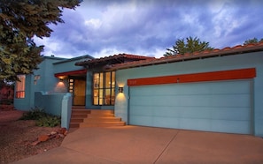 A modern house with a blue exterior, a red garage door, and a set of stairs leading to the front door. - Red Rock Views, Hot Tub, Community Pool, Walk To Pickleball Court, Trail Pass (Sedona)