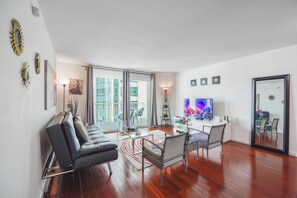 Deluxe Condo | Living room | 43-inch Smart TV with digital channels, TV, streaming services