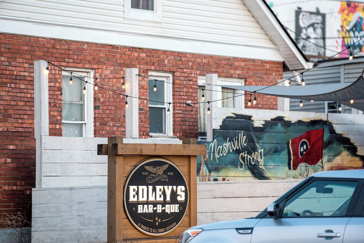 A brick building with a sign for Edley's Bar-B-Que.