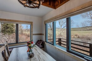 Enjoy expansive views of the surrounding countryside from the large windows in this room.