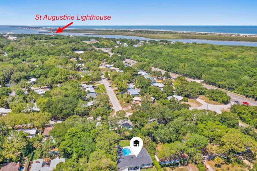 An aerial view of a residential area with a marked St Augustine Lighthouse.