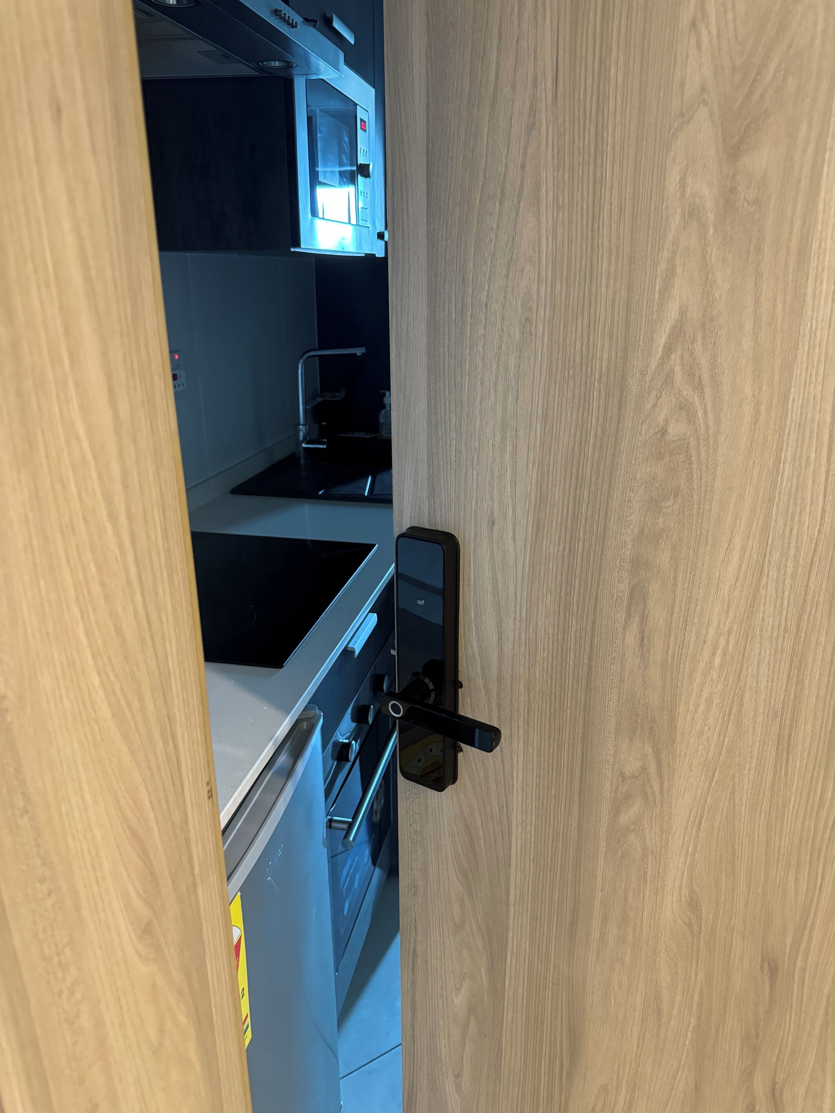 A kitchen with a microwave, stove, and oven.