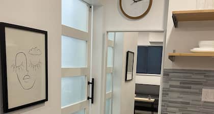 Brand new modern studio with private romantic garden in an upscale neighborhood