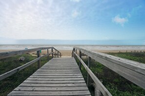 Walk along the boardwalk to the wide, sandy beach.
