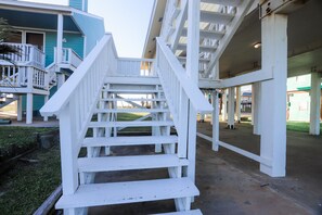 Staircase leads to a balcony with a view.